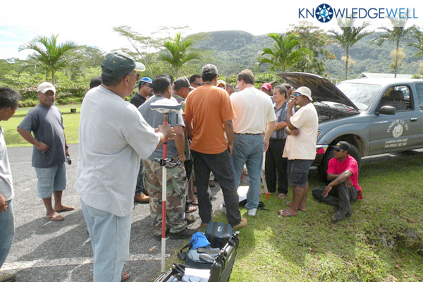 Visiting Surveyor Wigner Joe from neighboring Kosrae State holds rover during workforce training in Pohnpei Federated States of Micronesia